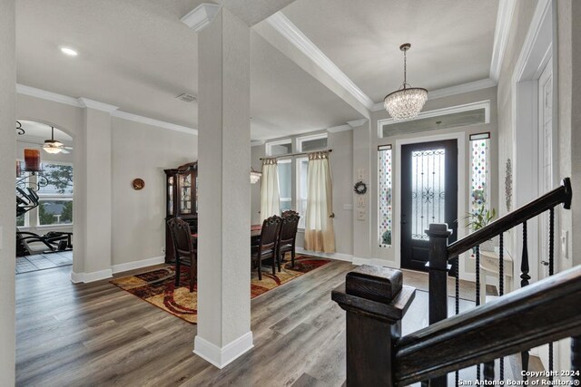 1207 Game Trl, New Braunfels, TX 78132 - living area featuring a ceiling fan, dark wood-type flooring, stairs, ornamental molding, and recessed lighting