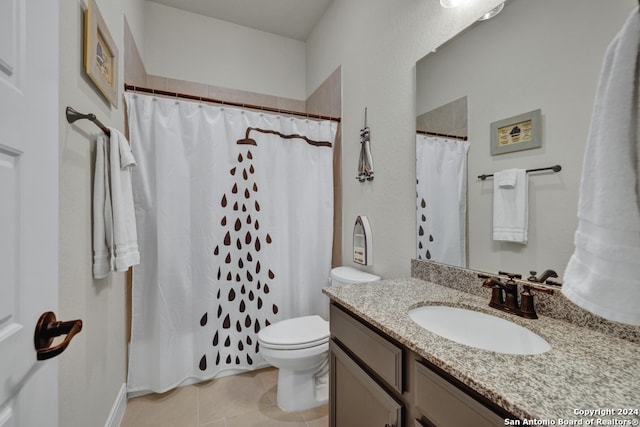 full bathroom with tile patterned flooring, a shower with shower curtain, vanity, and toilet