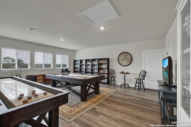 recreation room with recessed lighting, wood finished floors, visible vents, baseboards, and attic access