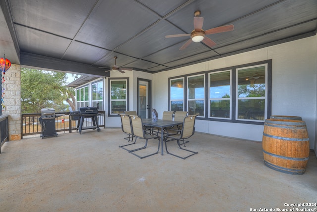 view of patio featuring ceiling fan, outdoor dining area, and grilling area