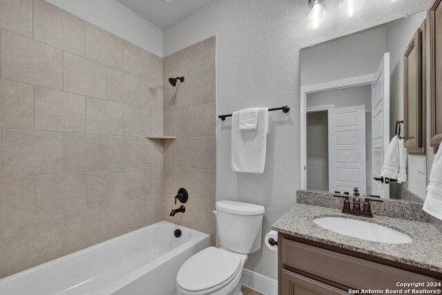 1207 Game Trl, New Braunfels, TX 78132 - bathroom featuring  shower combination, toilet, and vanity