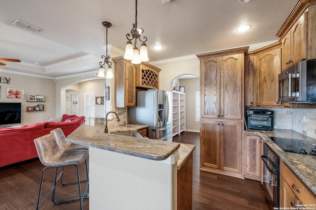 1138 Royal Eagle, Fischer, TX 78623 - kitchen with arched walkways, black appliances, open floor plan, ornamental molding, and dark wood-type flooring
