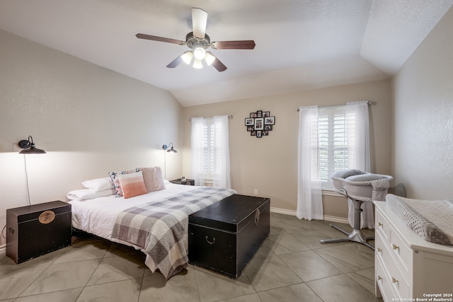 bedroom with ceiling fan and vaulted ceiling