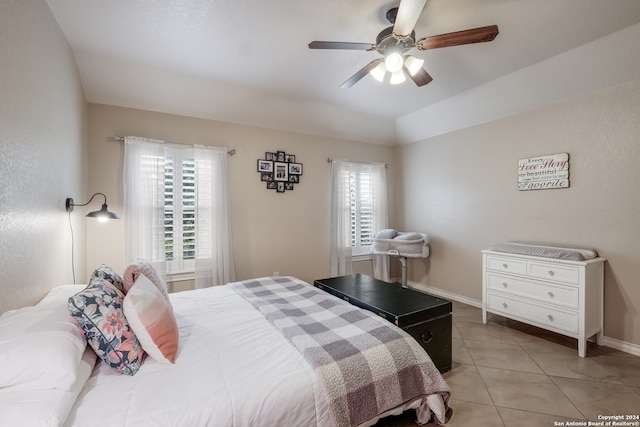 bedroom featuring light tile patterned floors and ceiling fan