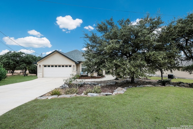 view of front facade with a front lawn and a garage