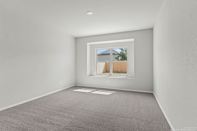 empty room with carpet flooring