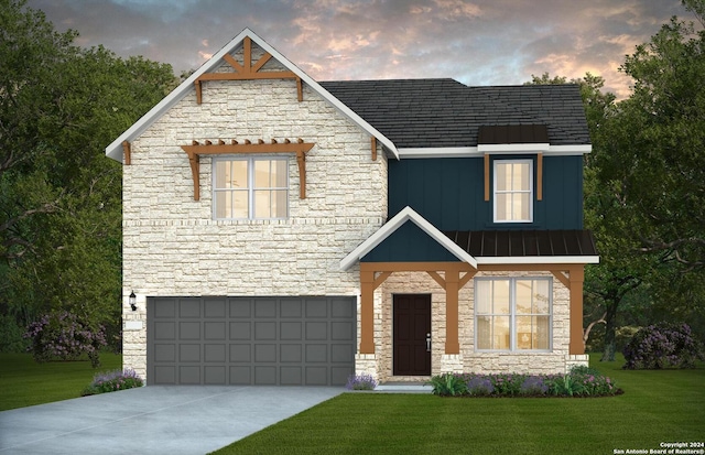 view of front of home with a garage, board and batten siding, a yard, and stone siding
