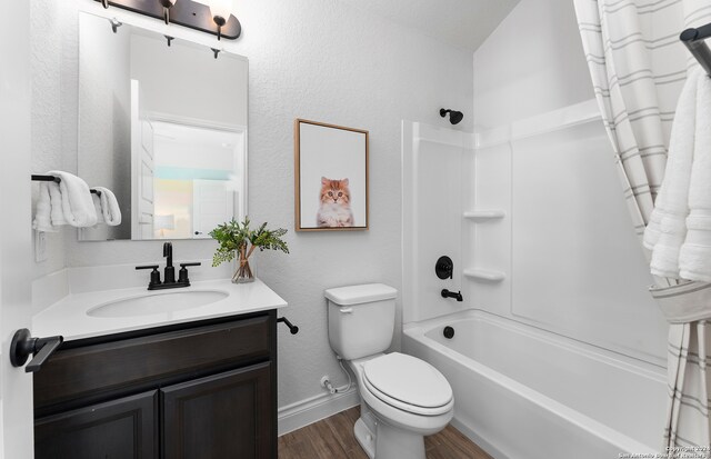 full bathroom featuring vanity, toilet, shower / bathtub combination with curtain, and wood-type flooring