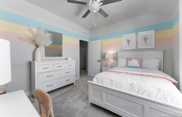 bedroom with lofted ceiling, light colored carpet, and ceiling fan