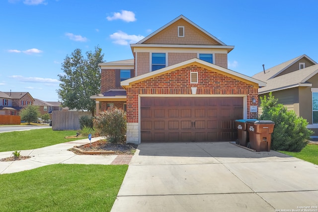 front of property with a front yard and a garage