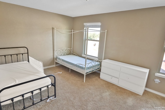 bedroom with light carpet