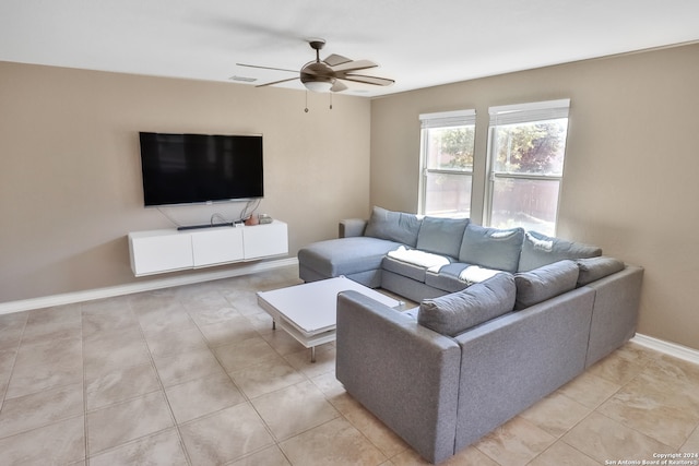 tiled living room featuring ceiling fan