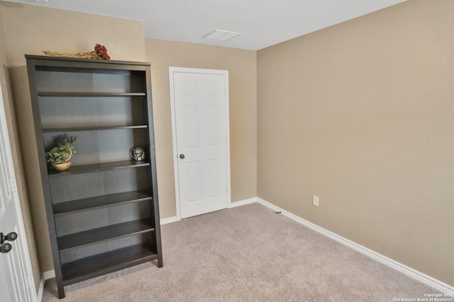 unfurnished bedroom featuring light colored carpet