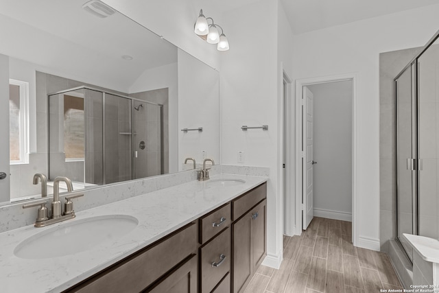 bathroom with vanity and walk in shower