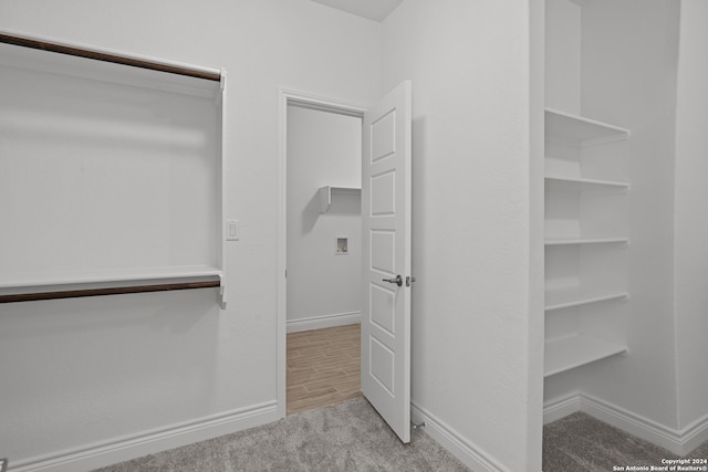 spacious closet with light hardwood / wood-style floors