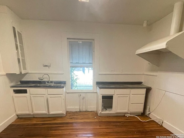 kitchen featuring white cabinets, sink, and dark hardwood / wood-style flooring