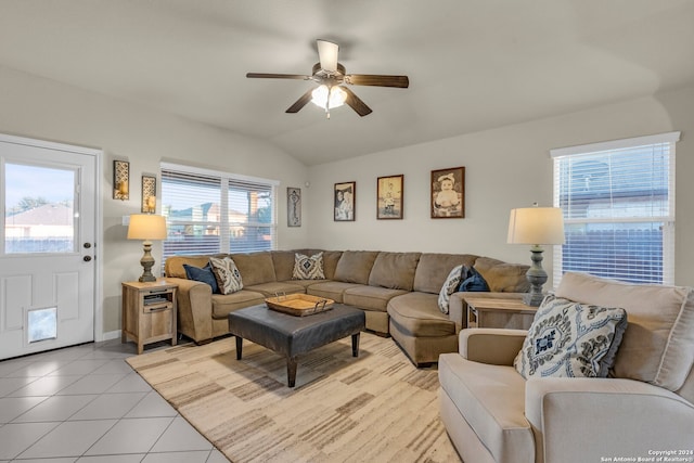 tiled living room with vaulted ceiling and ceiling fan