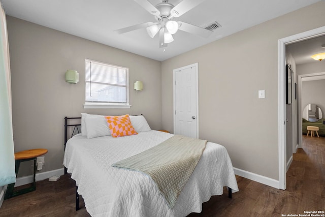 bedroom with ceiling fan and dark hardwood / wood-style flooring