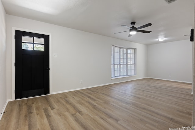 entrance foyer featuring light hardwood / wood-style floors and ceiling fan