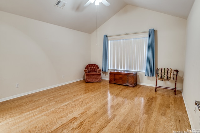 unfurnished room with light hardwood / wood-style flooring, lofted ceiling, and ceiling fan