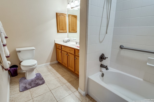 full bathroom with tiled shower / bath, vanity, toilet, and tile patterned floors