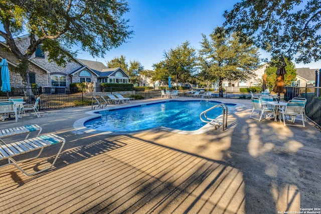 view of swimming pool with a patio area