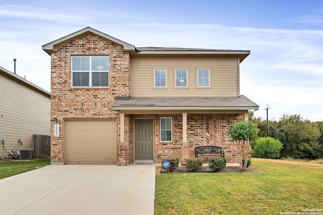 view of front of property with central air condition unit, a front lawn, and a garage