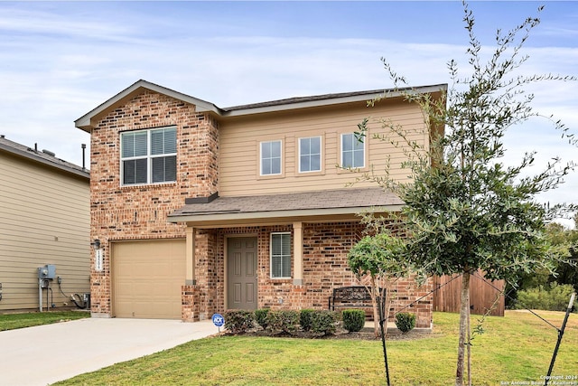 view of front of property featuring a front lawn and a garage