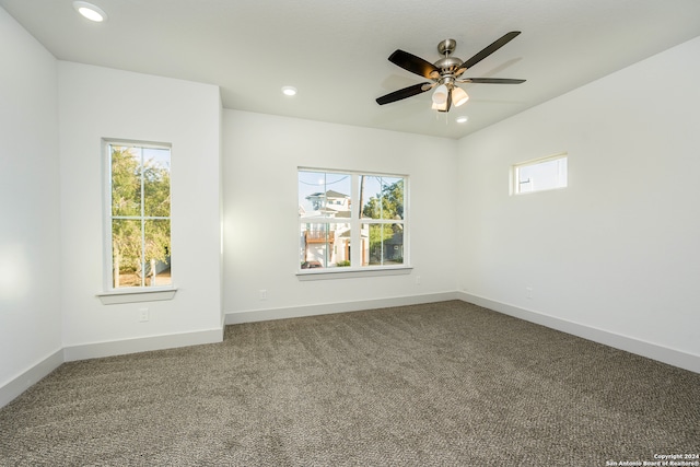 empty room with carpet and ceiling fan