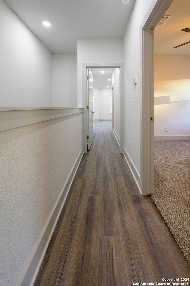 corridor featuring dark wood-type flooring