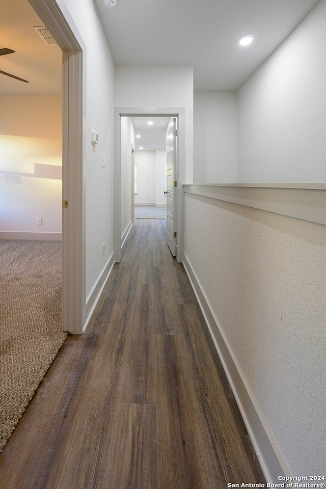 corridor featuring dark hardwood / wood-style flooring