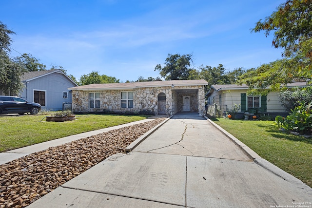 ranch-style home with a front lawn