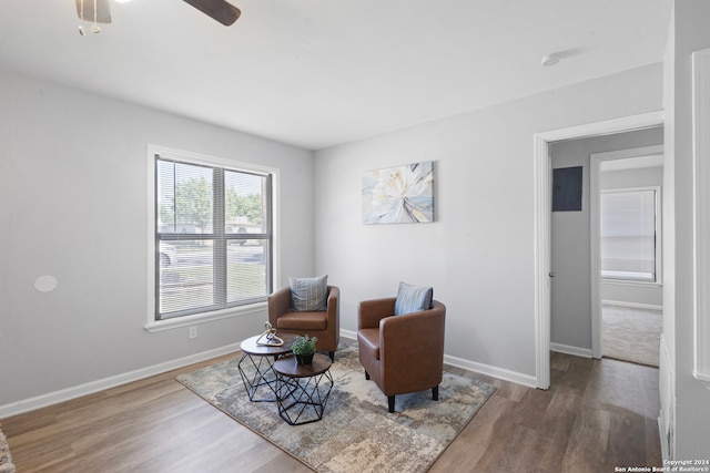 sitting room featuring hardwood / wood-style flooring and ceiling fan