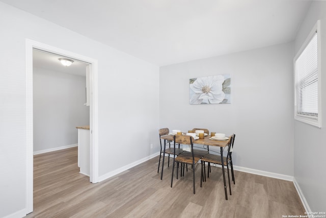 dining area with light hardwood / wood-style floors