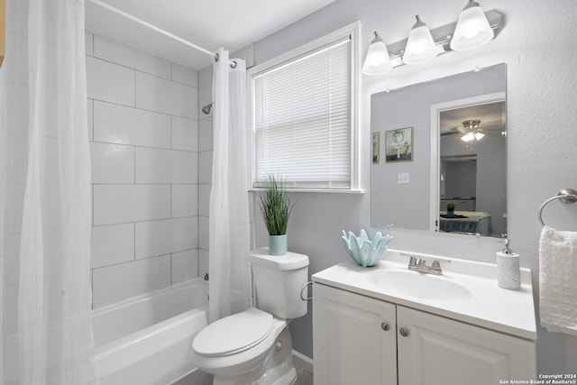 full bathroom featuring vanity, toilet, shower / tub combo, and ceiling fan