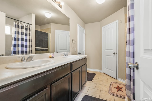 bathroom with vanity, tile patterned floors, and curtained shower