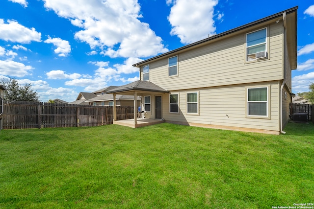 back of property featuring a patio, central air condition unit, and a lawn