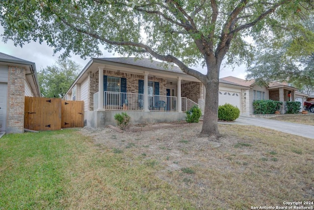 ranch-style house with covered porch and a garage