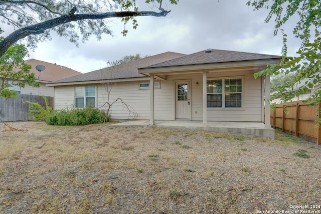 rear view of property featuring a patio