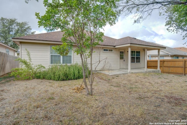 back of property with a patio area