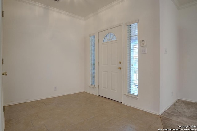 foyer entrance featuring ornamental molding