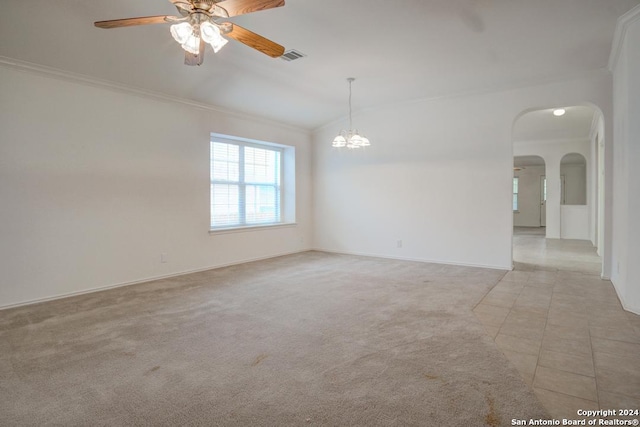 spare room featuring ornamental molding, vaulted ceiling, light colored carpet, and ceiling fan with notable chandelier