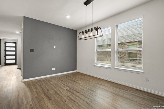 unfurnished dining area with hardwood / wood-style floors