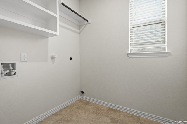 laundry area featuring hookup for a gas dryer, washer hookup, and electric dryer hookup