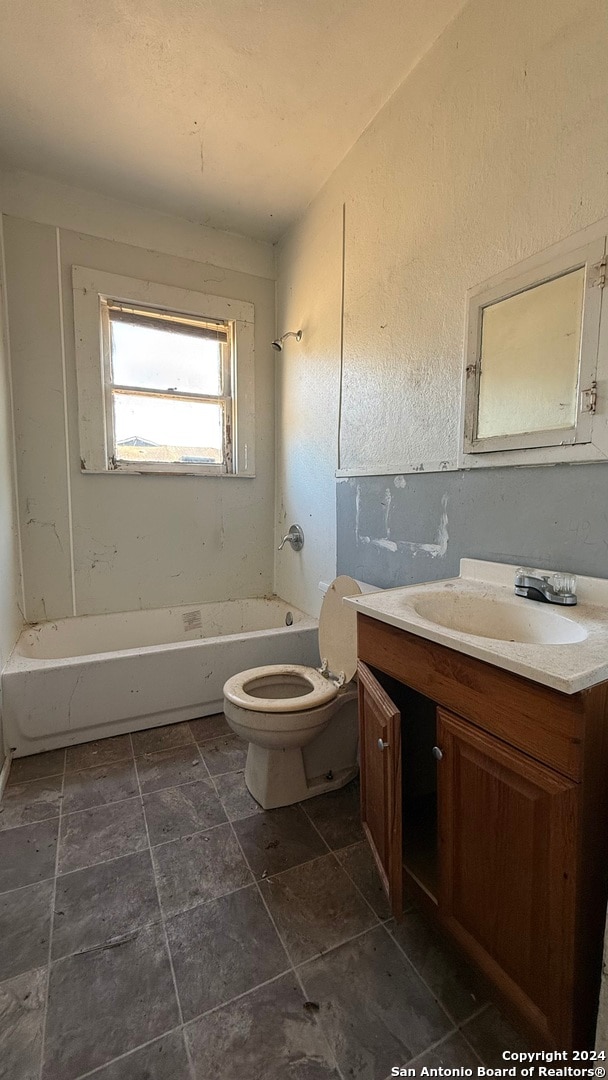 full bathroom featuring vanity, bathing tub / shower combination, and toilet