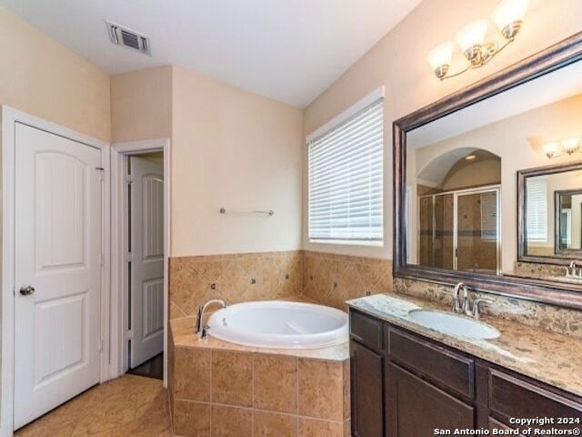 bathroom with vanity, separate shower and tub, and tile patterned flooring