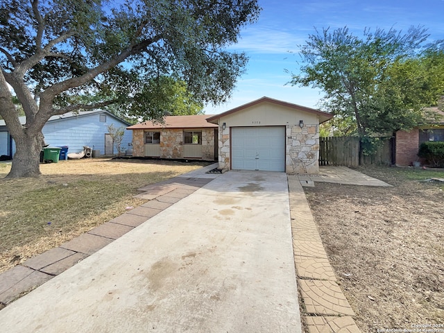 single story home with a garage