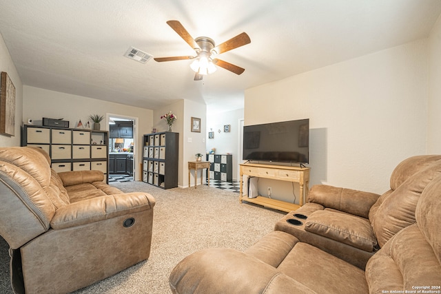 carpeted living room featuring ceiling fan