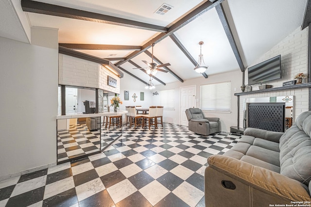 living room with beam ceiling, high vaulted ceiling, a fireplace, and ceiling fan