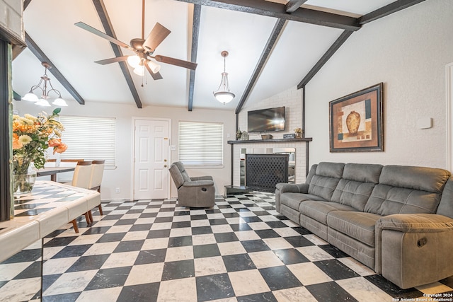 living room featuring vaulted ceiling with beams, a fireplace, and ceiling fan